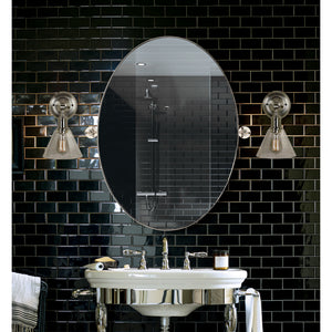 Azalea mirror by Renwil in a bathroom setting, surrounded by black tile and stylish lighting