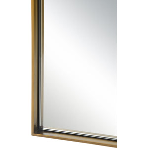 Close-up view of Northern mirror's gold frame highlighting the reflective surface.