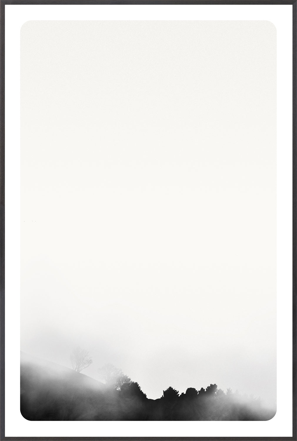 Genesis IV wall art featuring a minimalist black and white landscape with fog and trees.