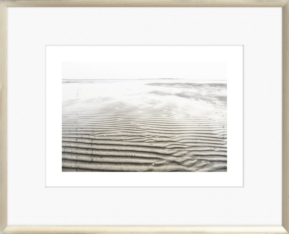 Taupe Aspect II wall art featuring textured sand patterns in black and white, framed in a light wood frame.