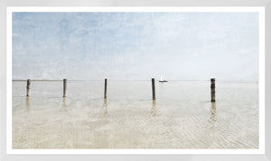 Serene Shallows I wall art featuring a tranquil seascape with wooden posts and a sailboat.