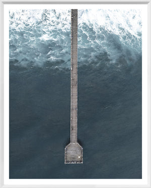 Deep Blue Wharf wall art featuring an aerial view of a pier over dark blue ocean waves