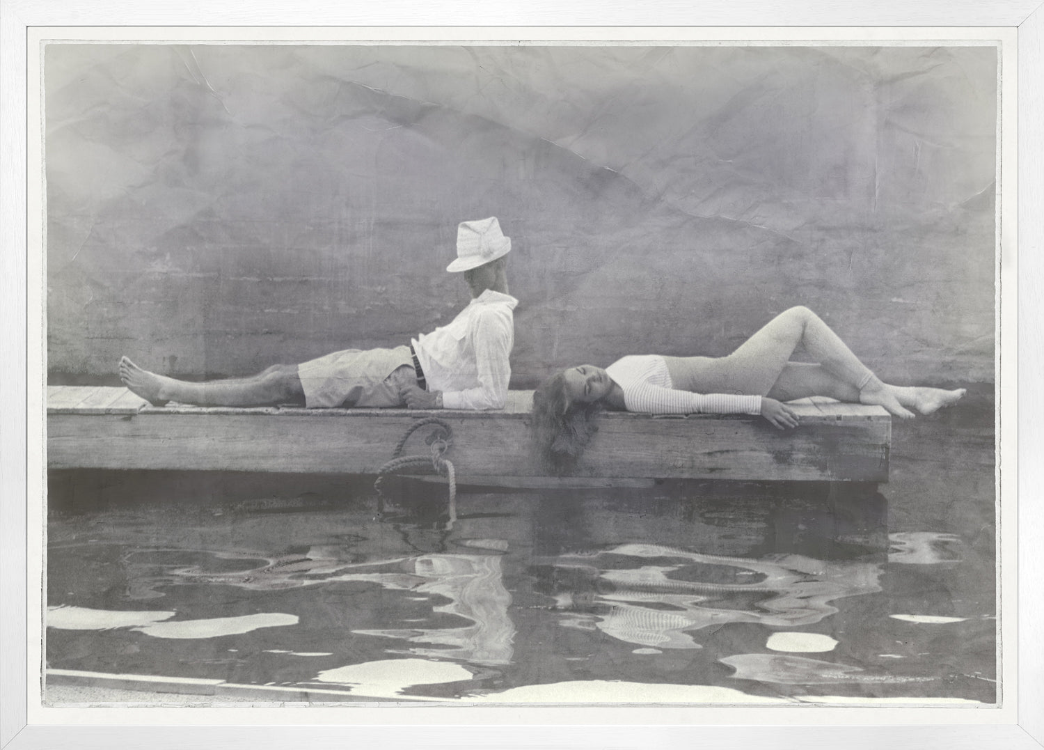 Indigo Stained – Leisure Time wall art featuring a black and white photo of a man and woman on a dock.