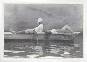 Indigo Stained – Leisure Time wall art featuring a black and white photo of a man and woman on a dock.