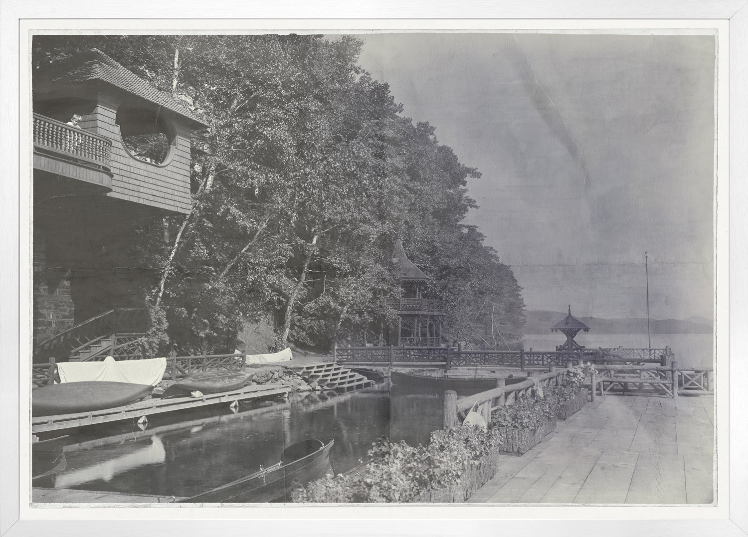 Indigo Stained wall art featuring a serene dock scene with boats and trees.