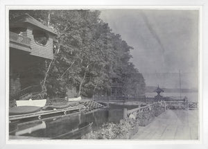 Indigo Stained wall art featuring a serene dock scene with boats and trees.