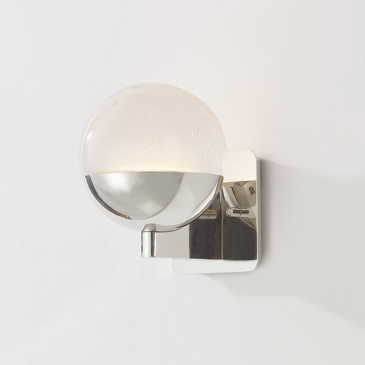 Close-up of the Rochford Wall Sconce in polished nickel showing the arm curve and shade silhouette.