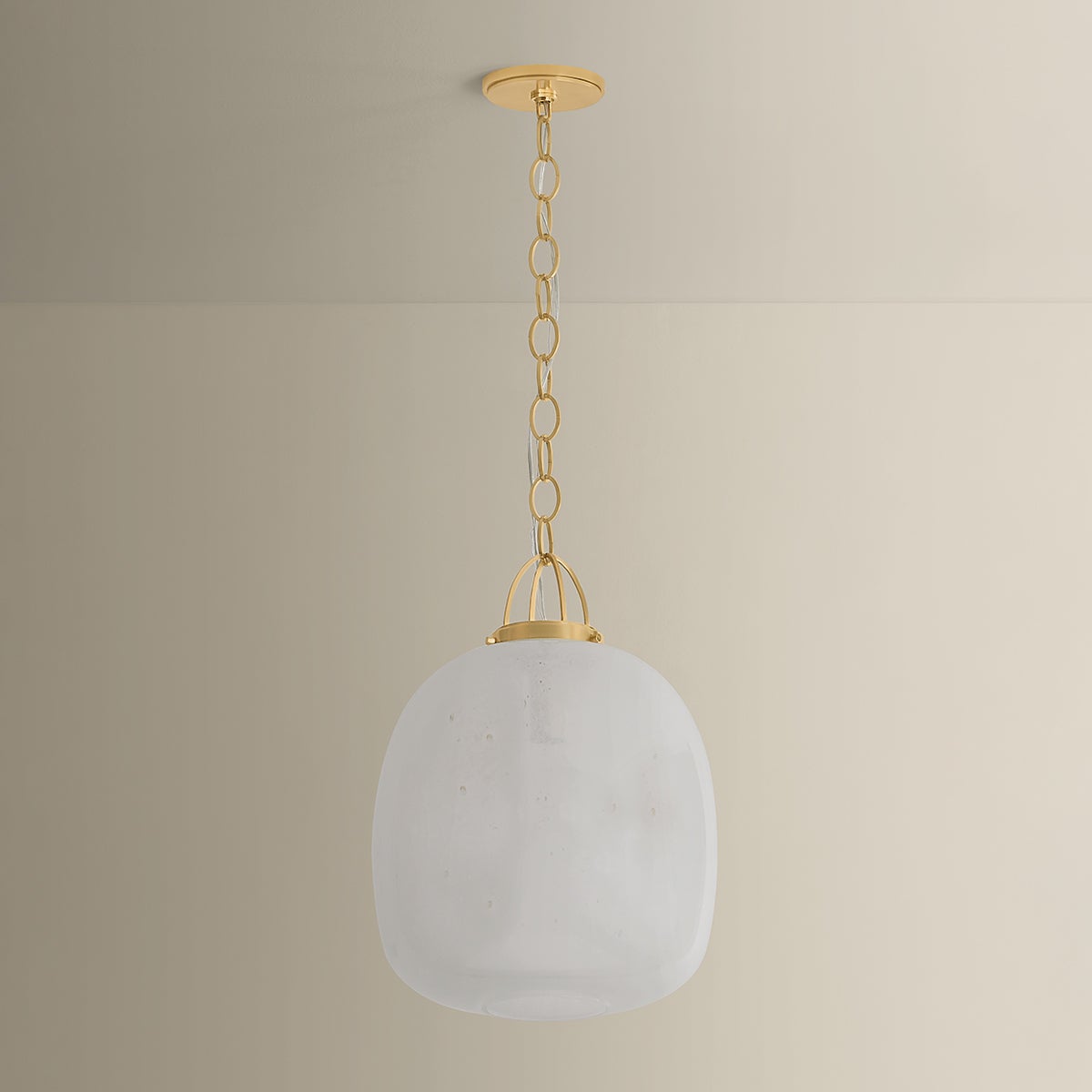 Enosburg Pendant 16" in aged brass shown from the front to reveal the shade shape and metal detail.