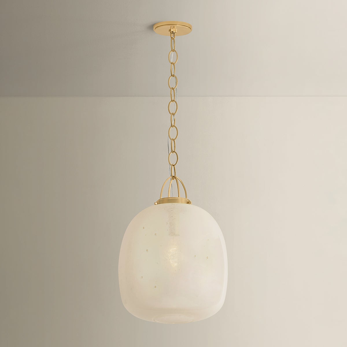 Close-up of the Enosburg Pendant 16" in aged brass showing the shade shape and metal detail.