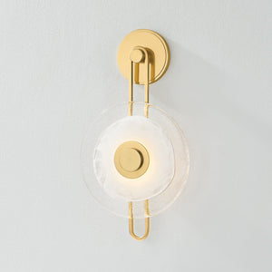 Close-up of the Keuka Park Wall Sconce in aged brass showing the arm curve and shade silhouette.