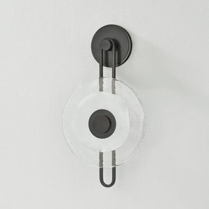Close-up of the Keuka Park Wall Sconce in bronze showing the arm curve and shade silhouette.