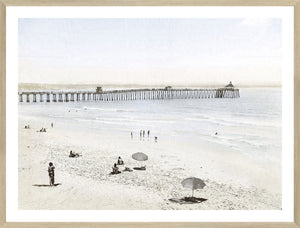 Imperial Beach CA wall art featuring a serene beach scene with a pier, soft colors, and people relaxing.