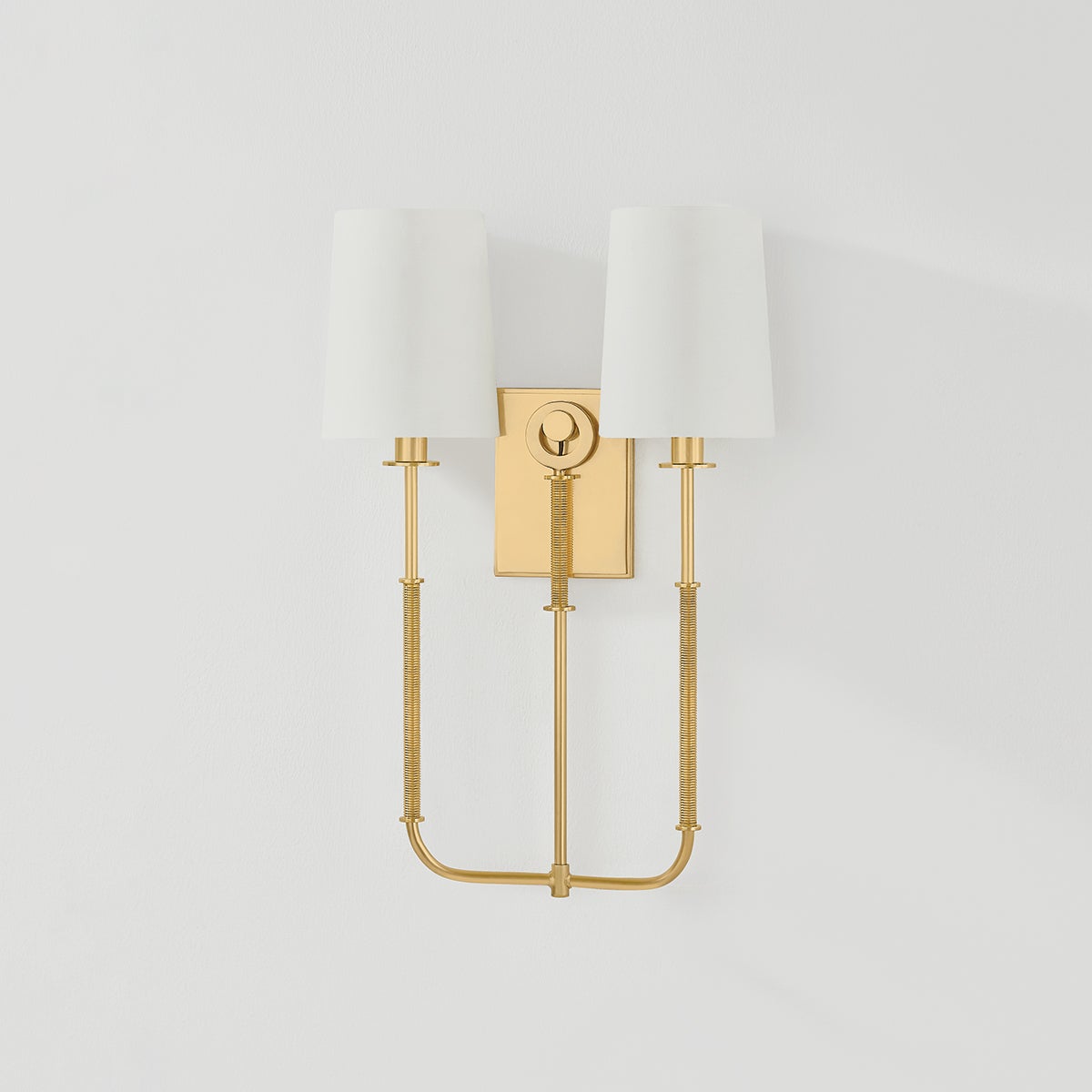 Glenmont Wall Sconce 14" in aged brass shown from the front to reveal the arm curve and shade silhouette.