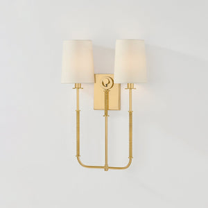 Close-up of the Glenmont Wall Sconce 14" in aged brass showing the arm curve and shade silhouette.