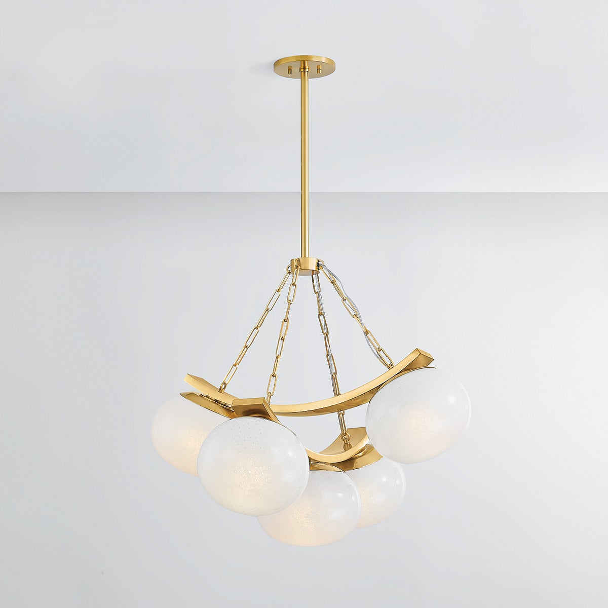 Close-up of the Duxbury Chandelier 31.75" in aged brass showing the frame, arms, and shade detail.
