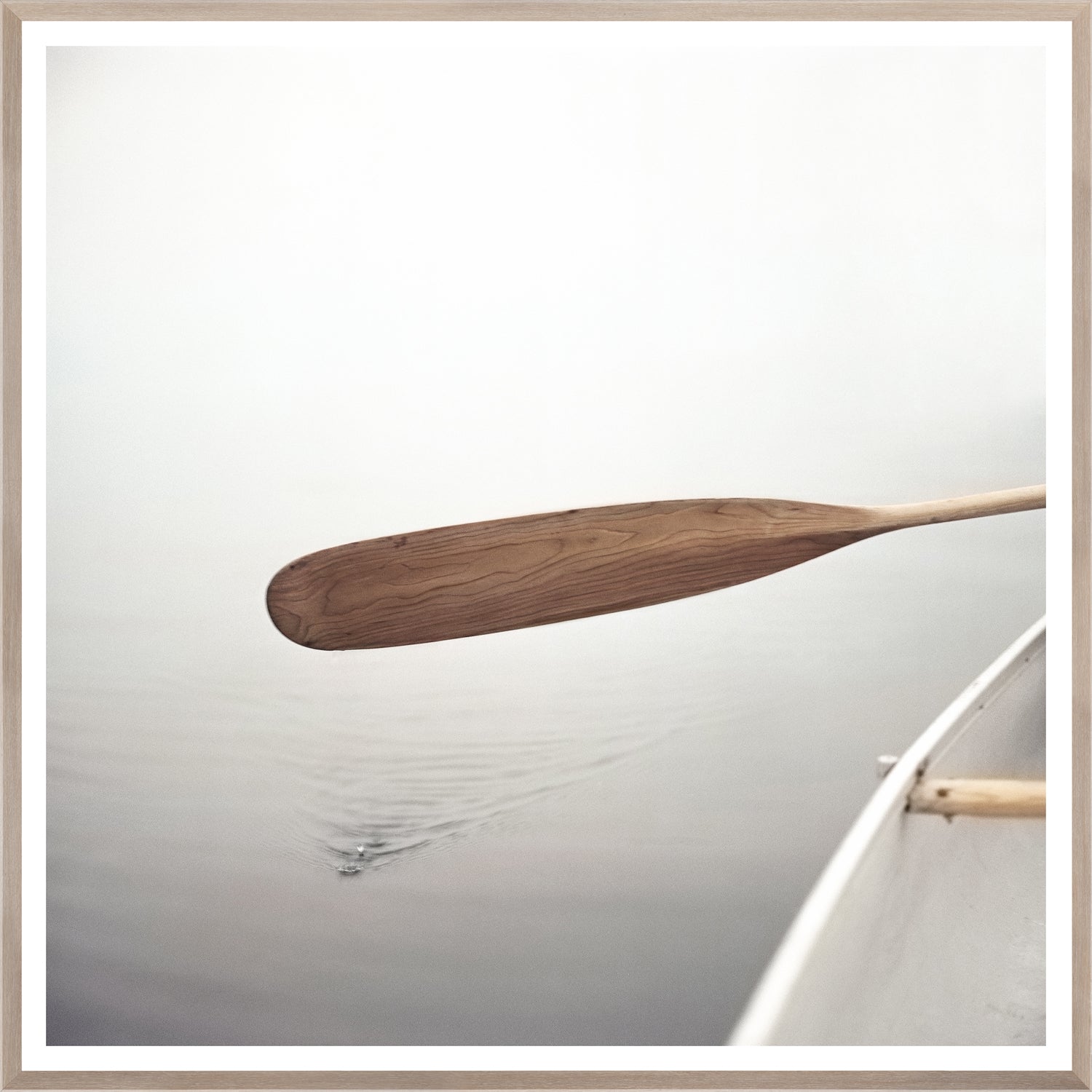 The Paddle wall art featuring a wooden paddle above calm water
