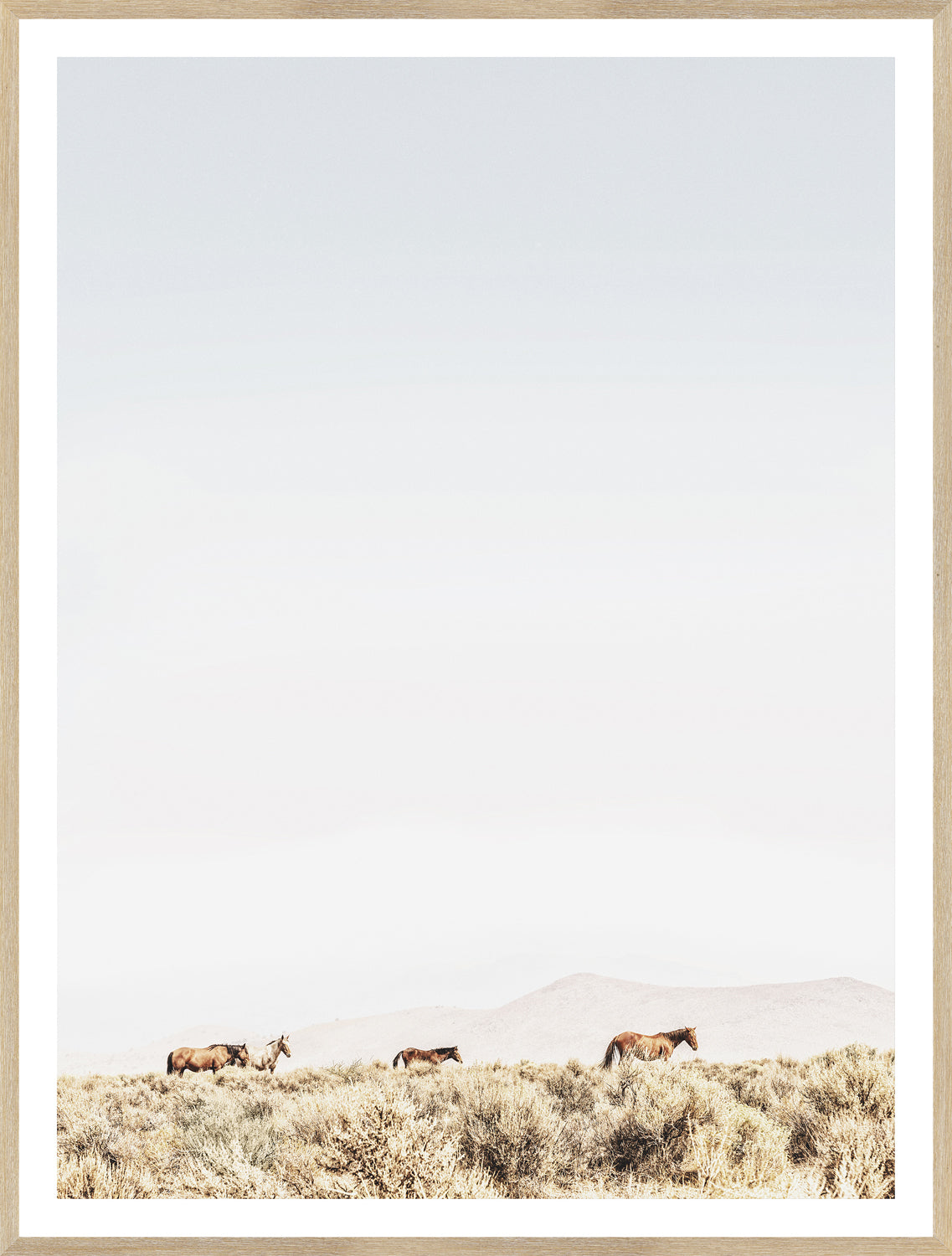 Sage Ridge, Horses wall art featuring four horses grazing in a serene landscape with soft colors and a light frame.