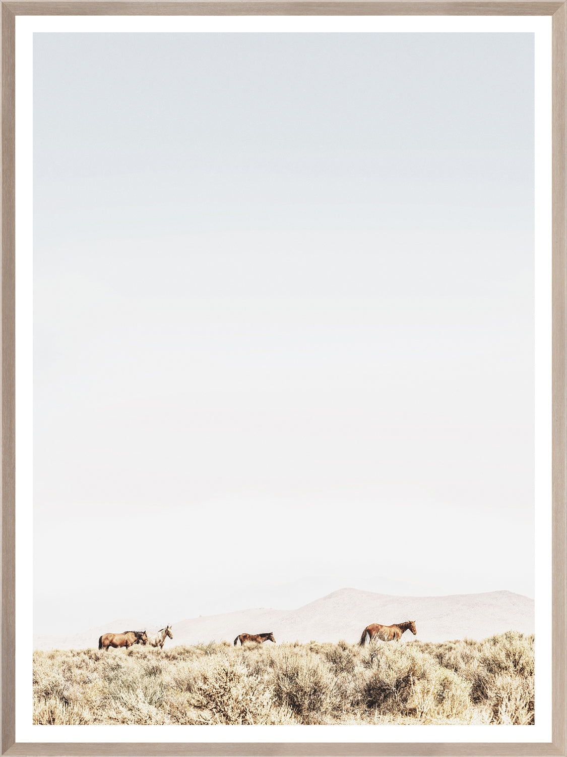 Sage Ridge, Horses wall art featuring four horses grazing in a serene landscape with soft colors and a light frame.