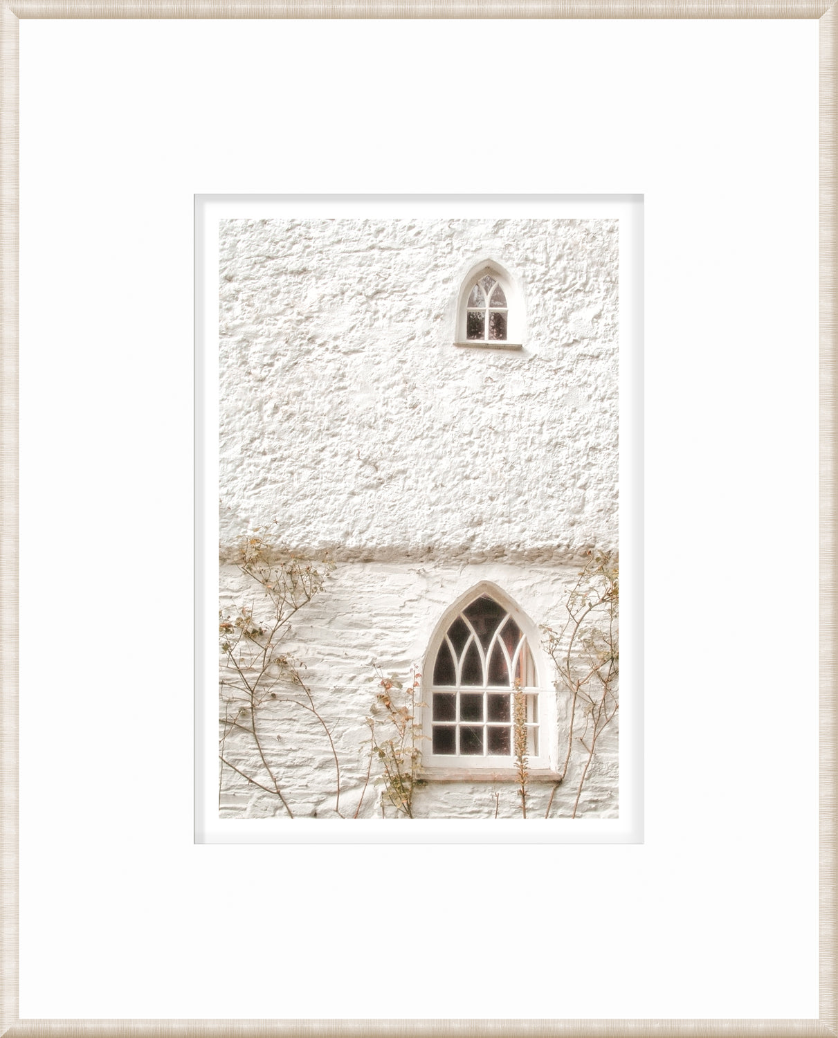 Masonry – Arched Windows wall art featuring two arched windows on a textured white wall.