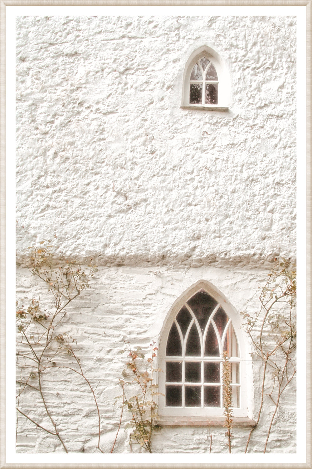 Masonry – Arched Windows wall art featuring two arched windows on a textured white wall.