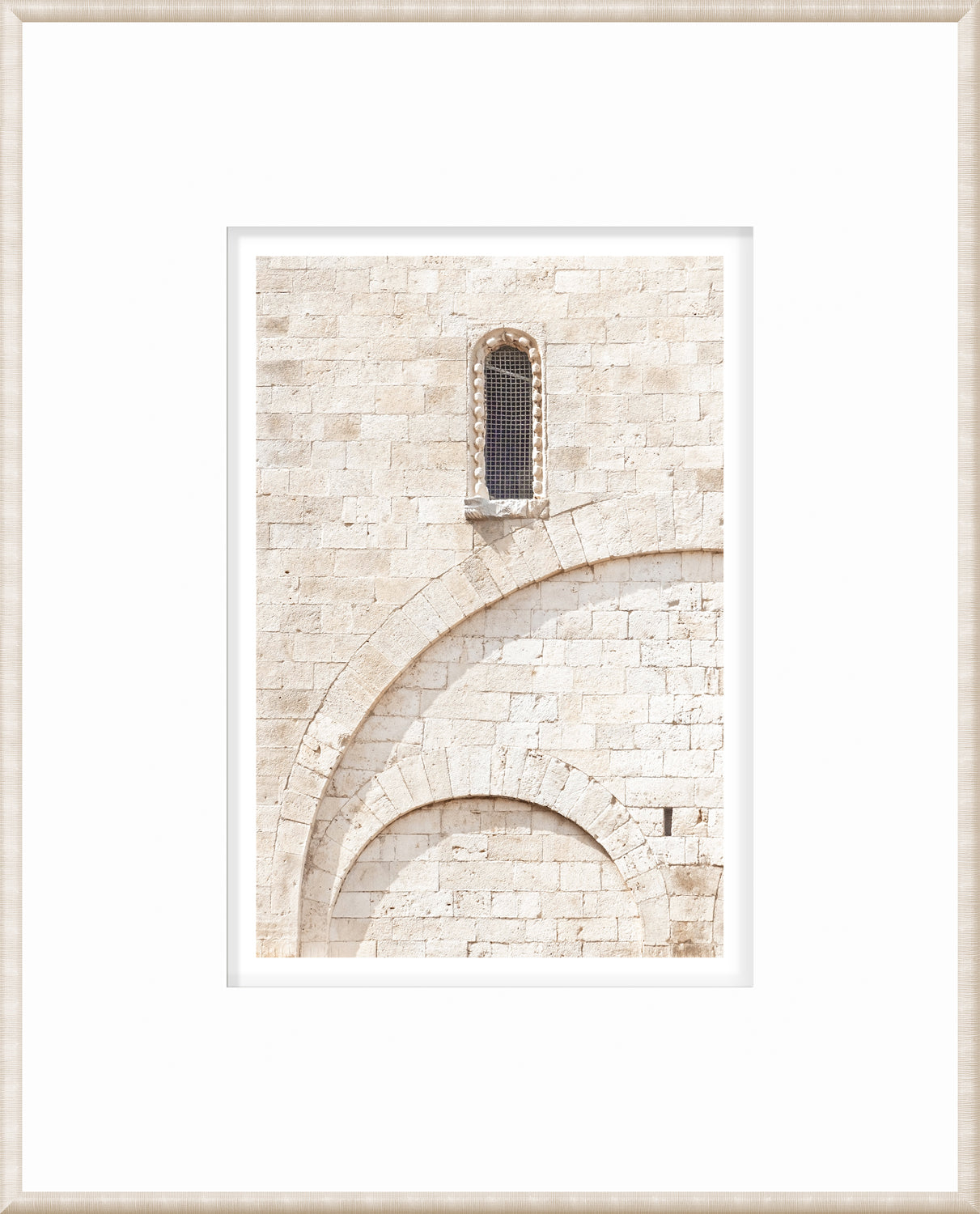 Masonry wall art featuring a stone wall with a window and arch details in light tones.