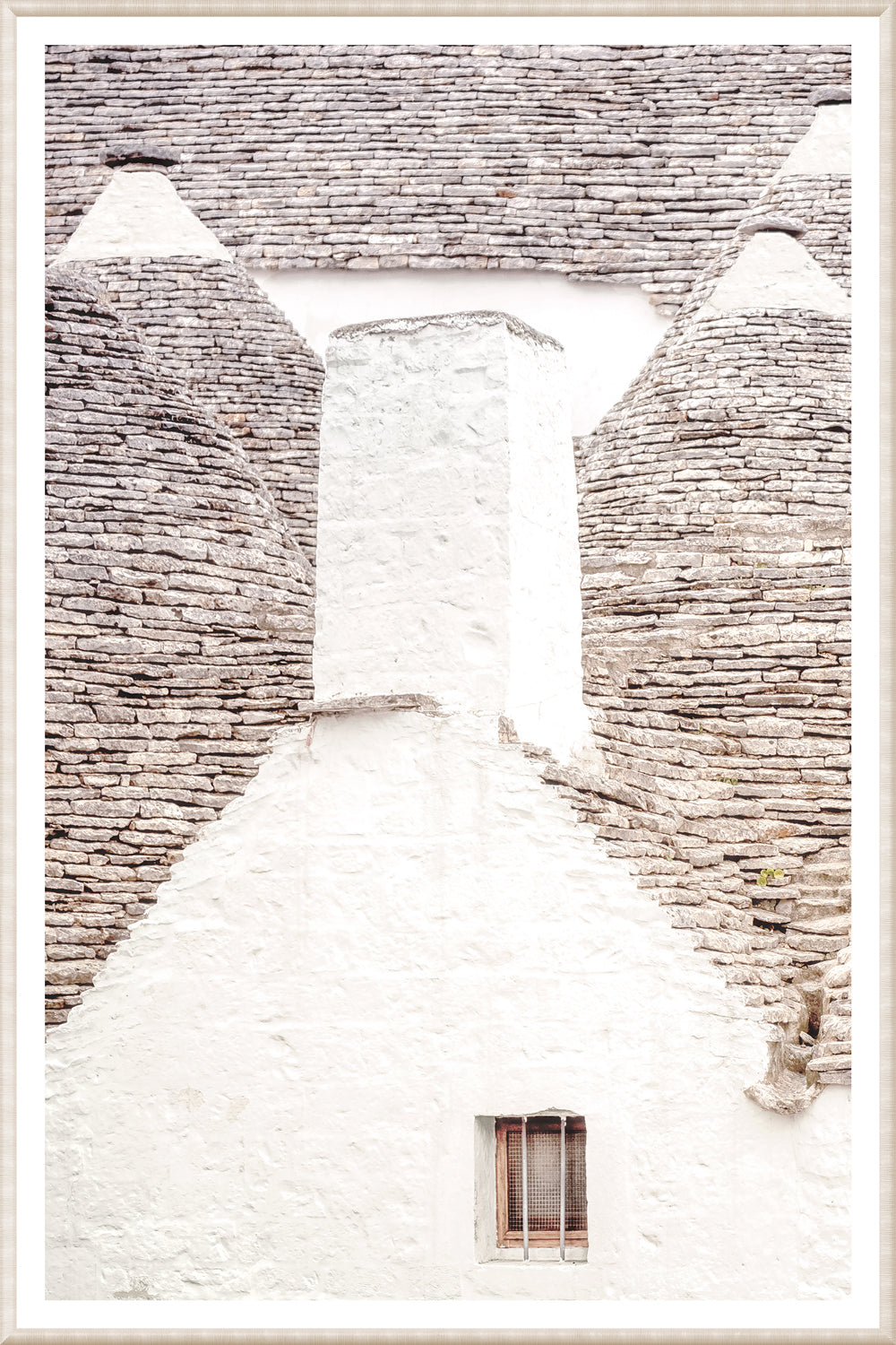 Masonry – Trullo Rooftops wall art featuring white stone structure with gray stone rooftops.