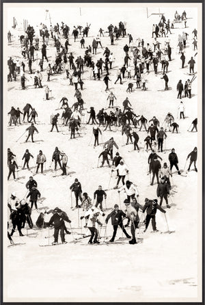 Ski Vacation II wall art featuring a vintage black and white ski scene with numerous skiers on a snowy slope.