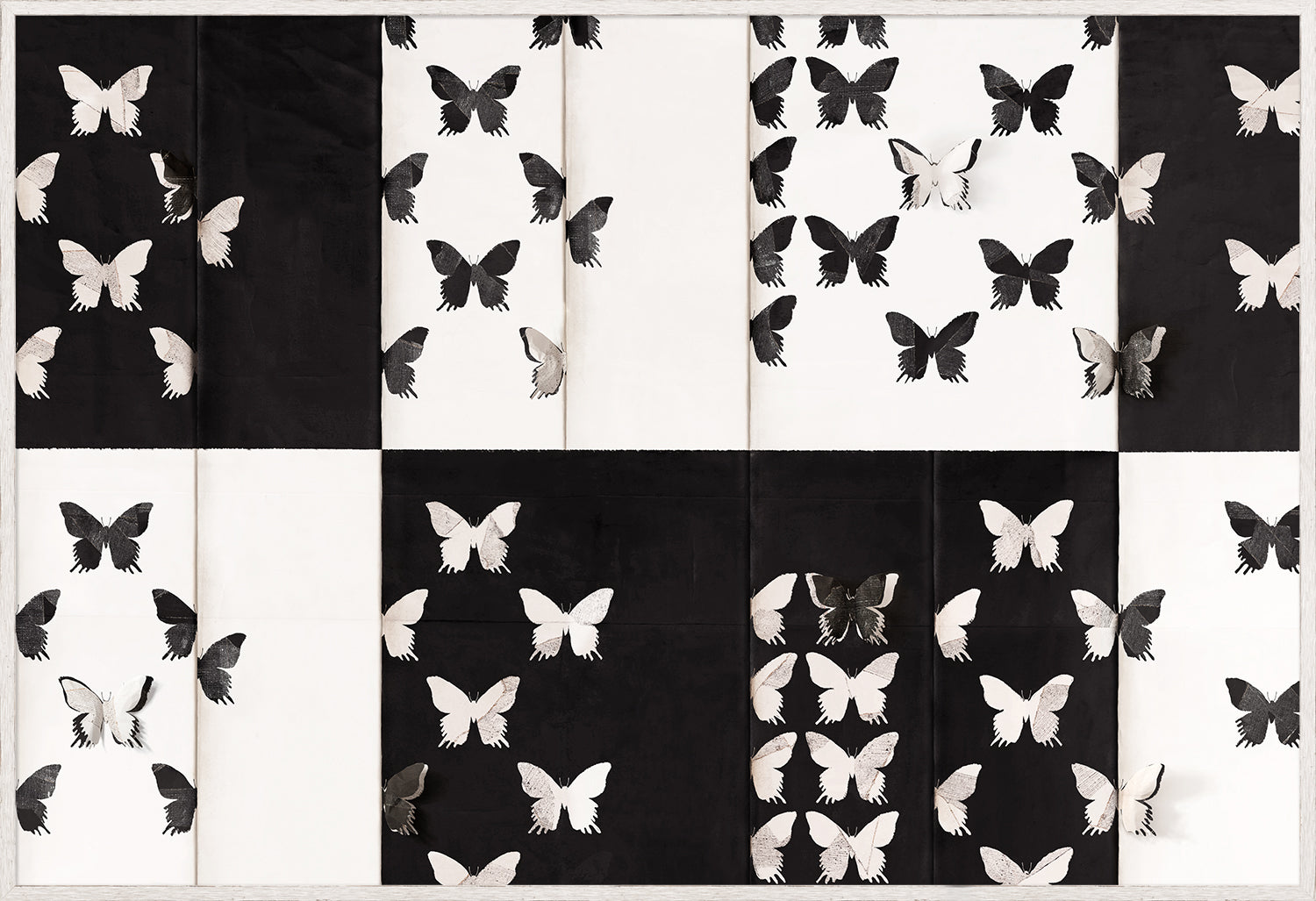 Mariposa wall art featuring black and white butterfly patterns on a textured background.