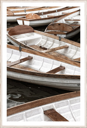 At Mooring II wall art featuring white boats with wooden accents on dark water.