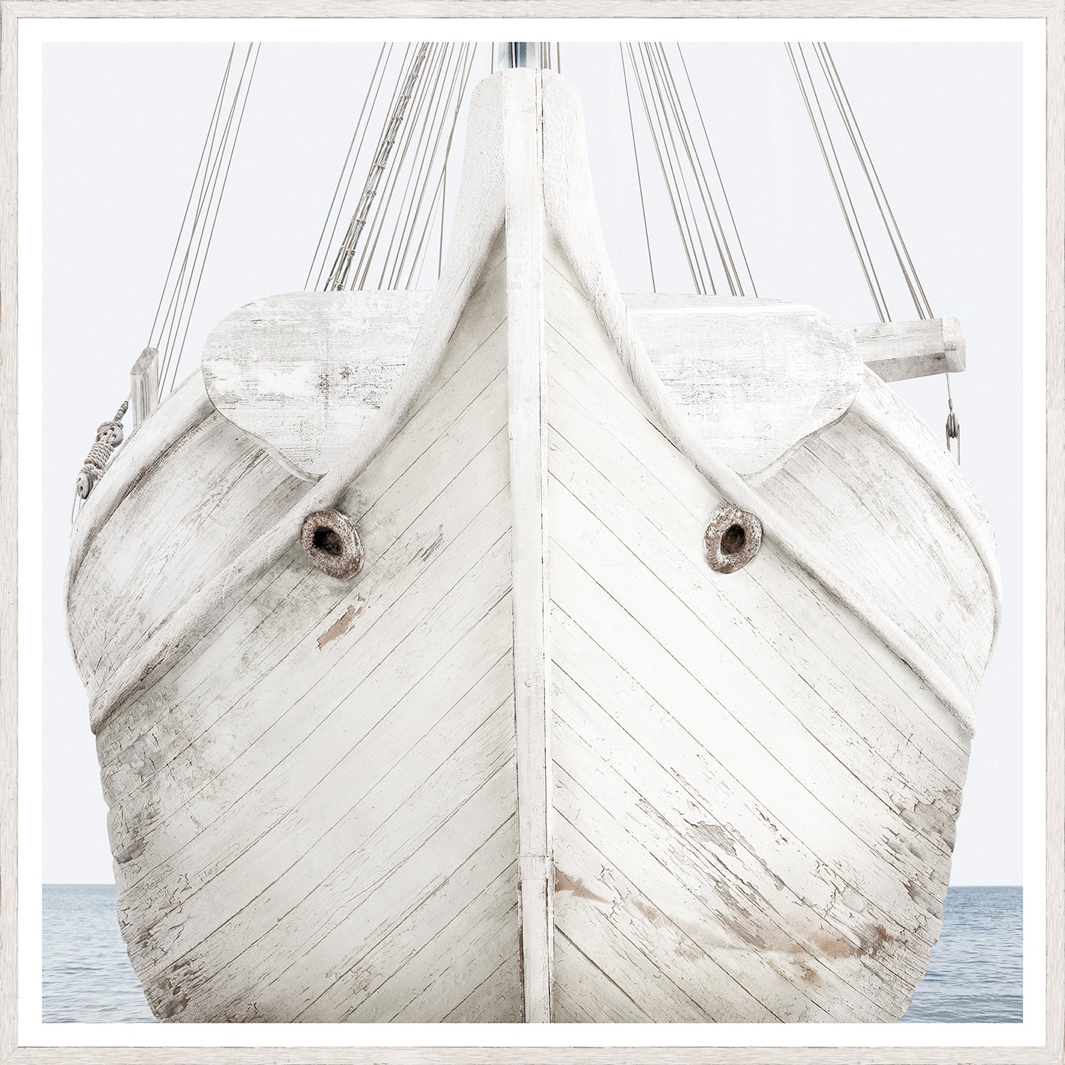 Seaworn Bows II wall art featuring a close-up of a weathered white boat bow against a calm sea.