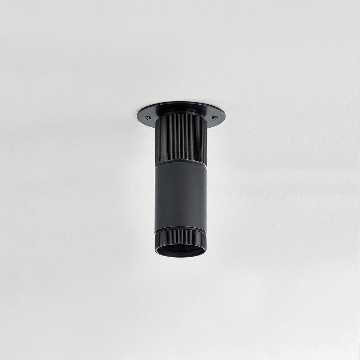 Close-up of the Dighton Flush Mount in dark bronze showing the shade profile and mounting canopy.