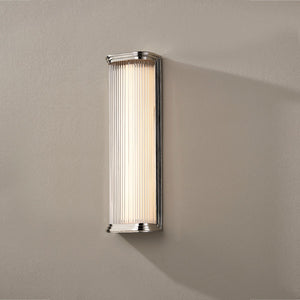 Close-up of the Newburgh Bath And Vanity 5.25" x 17" in polished nickel showing the arm spread and shade silhouette.