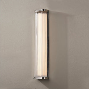 Close-up of the Newburgh Bath And Vanity 5.25" x 24.5" in polished nickel showing the arm spread and shade silhouette.