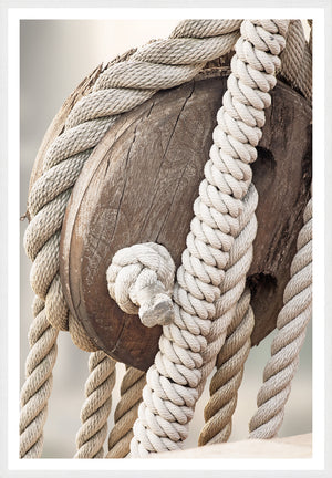 Sailing Details III wall art featuring a close-up of a wooden pulley with white ropes.