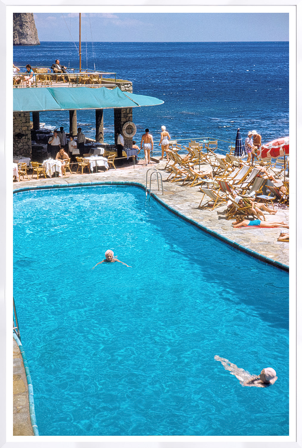Toni Frissell – Capri, Ocean Side C. 1959, vibrant pool scene with swimmers and ocean view