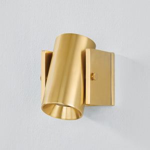Nowra Wall Sconce in Aged Brass shown from the front to reveal the arm curve and shade silhouette.