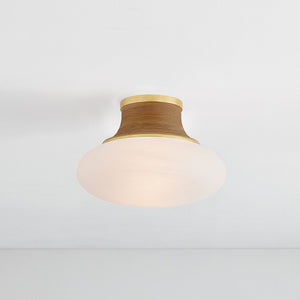 Pearl River Flush Mount 11" in aged brass shown from the front to reveal the shade profile and mounting canopy.