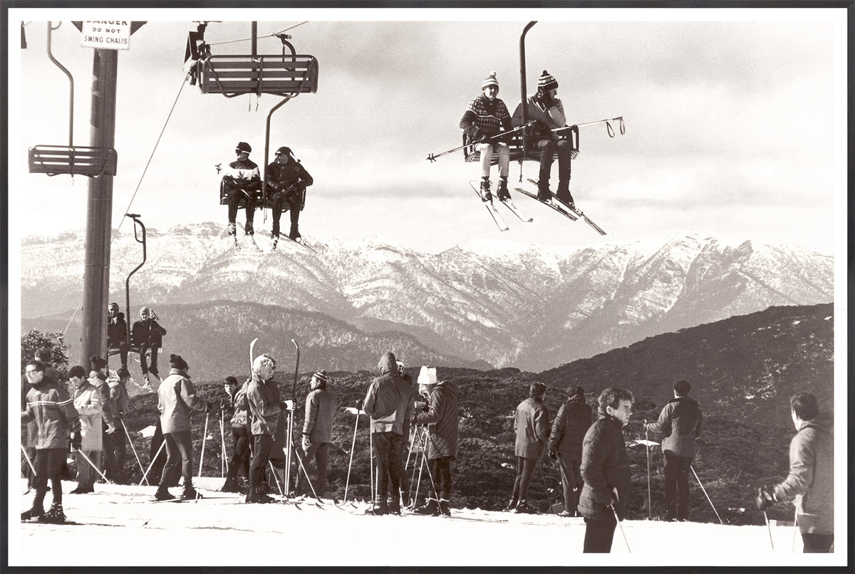 Ski Summit C. 1966 wall art featuring skiers on a chairlift with snowy mountains in the background.