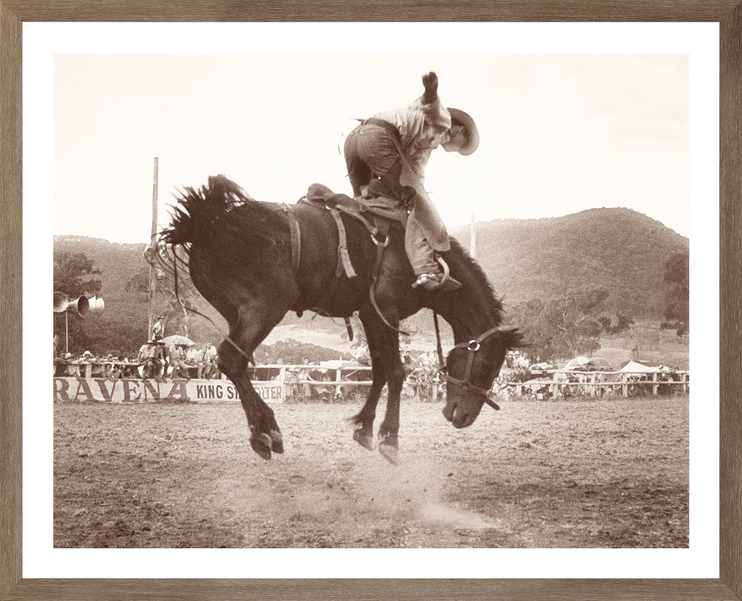 Rodeo I C. 1962 wall art featuring a cowboy riding a bucking horse in sepia tones.
