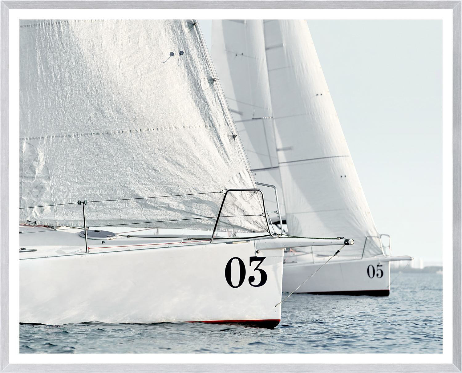 Racing Yachts wall art featuring two white sailboats with numbers 03 and 05 on the hulls.