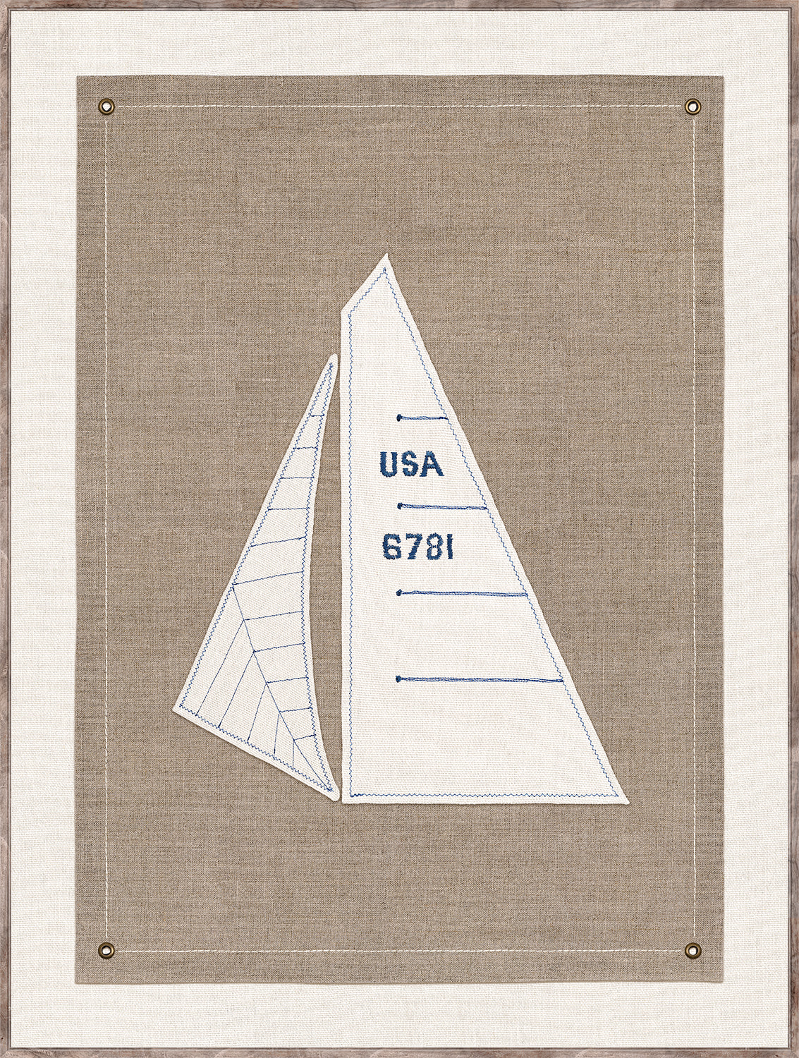 Set Sail III wall art featuring embroidered sailboat design on beige fabric with blue stitching and brass grommets.