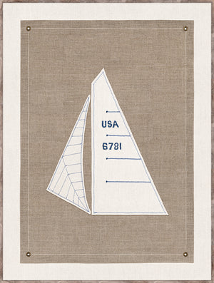 Set Sail III wall art featuring embroidered sailboat design on beige fabric with blue stitching and brass grommets.