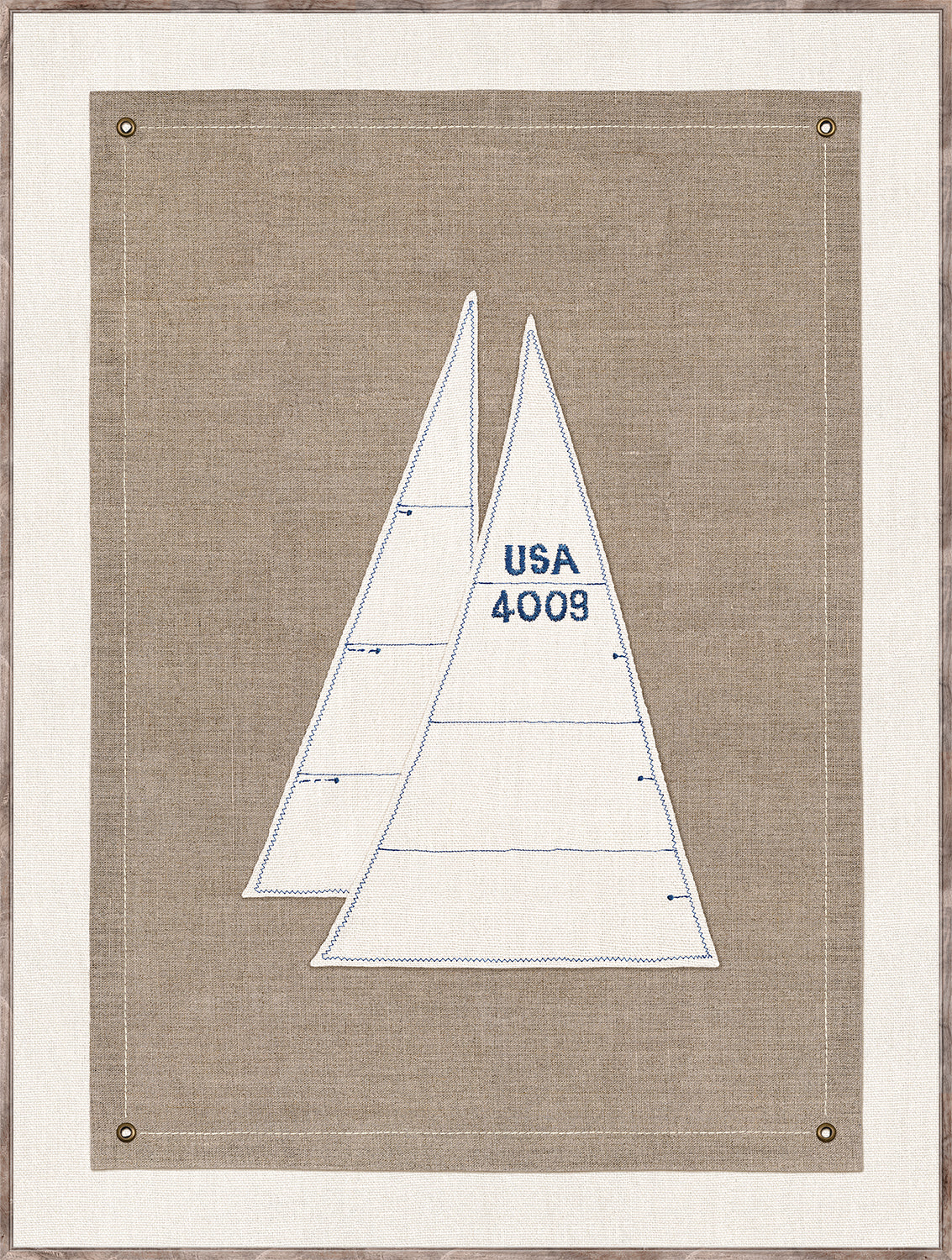 Set Sail IV wall art featuring two sailboat sails in white and blue on a textured beige background.