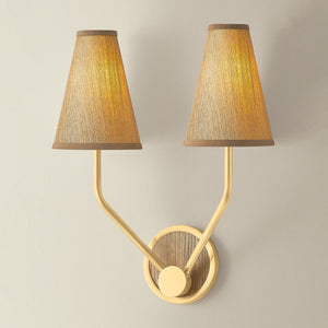 Buskirk Wall Sconce 15" in aged brass shown from the front to reveal the arm curve and shade silhouette.
