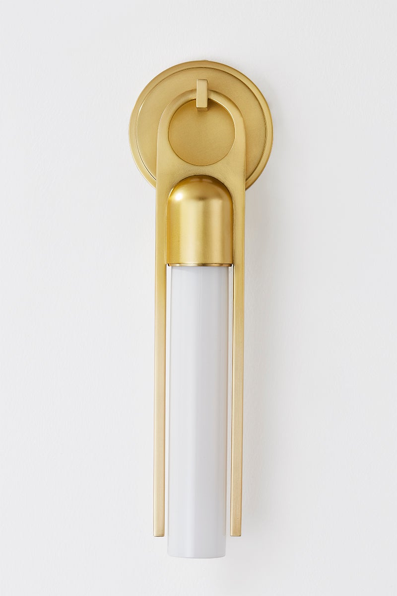 Bethlehem Wall Sconce in aged brass shown from the front to reveal the arm curve and shade silhouette.