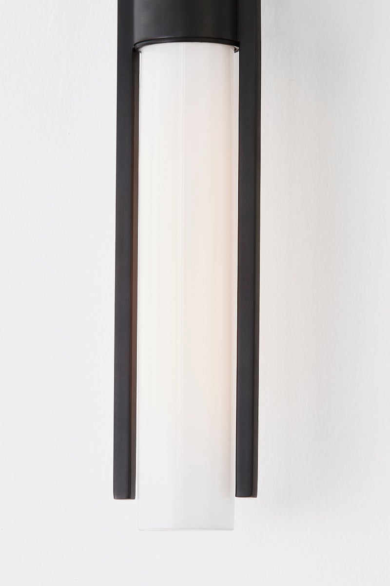 Close-up of the Bethlehem Wall Sconce showing the arm curve and shade silhouette.