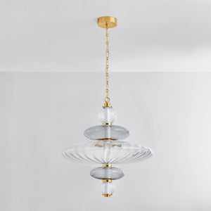 Williams Pendant 24.75" in aged brass shown from a second angle to highlight the shade shape and metal detail.