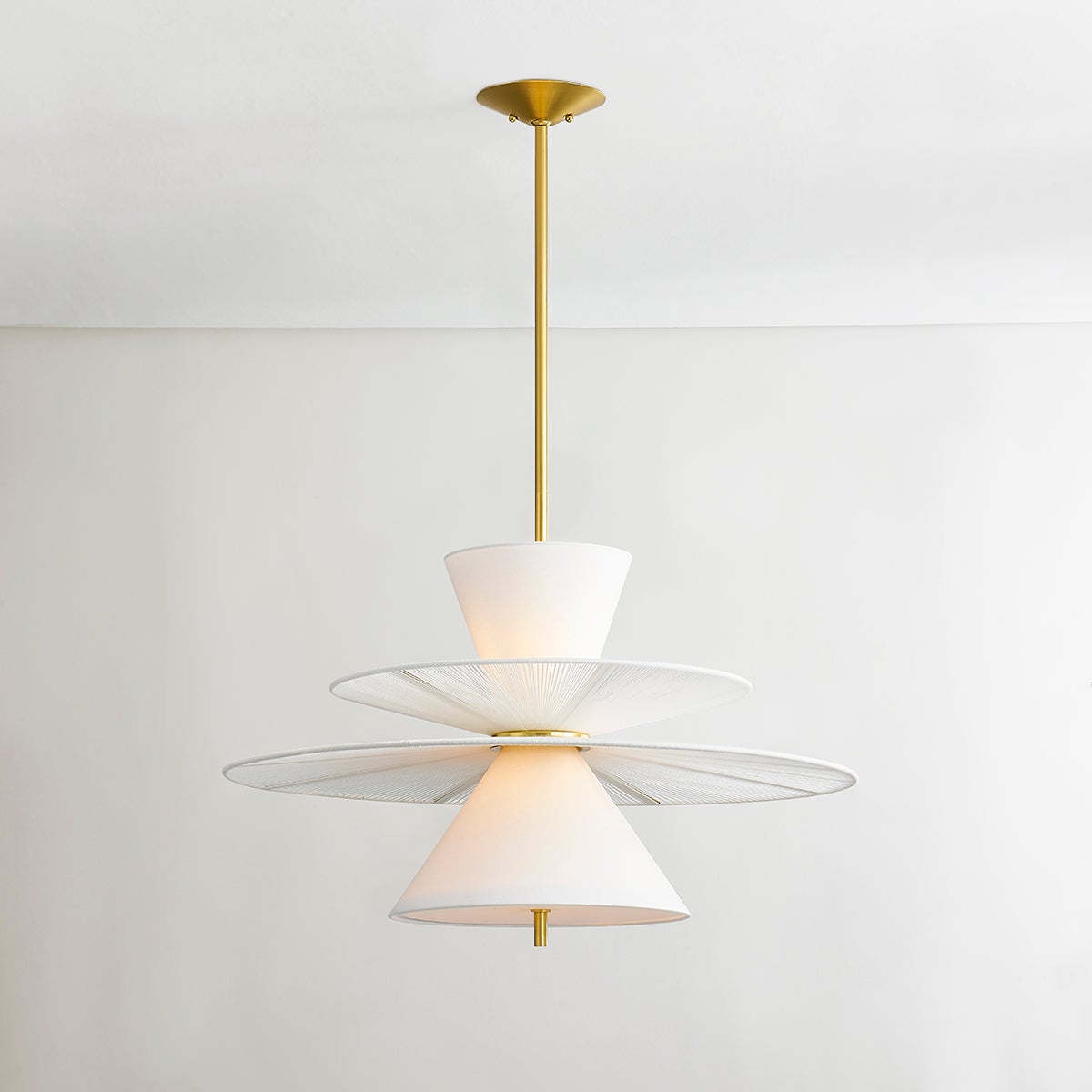 Close-up of the Esperance Pendant in aged brass showing the shade shape and metal detail.