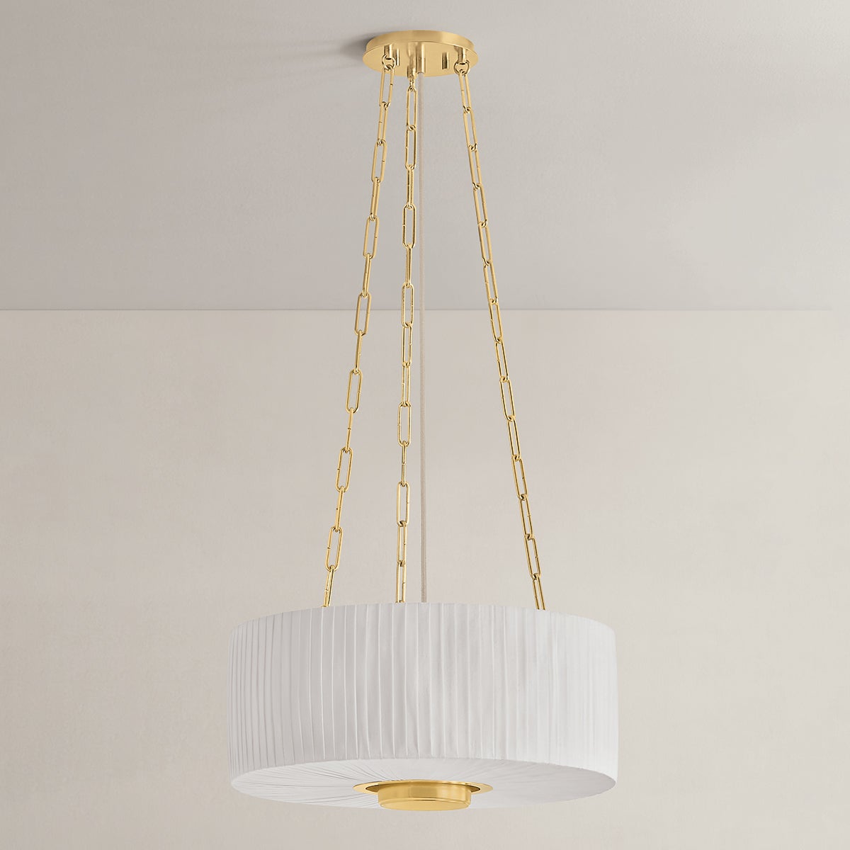 Camby Pendant in aged brass shown from the front to reveal the shade shape and metal detail.