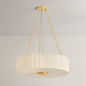 Close-up of the Camby Chandelier in aged brass showing the frame, arms, and shade detail.